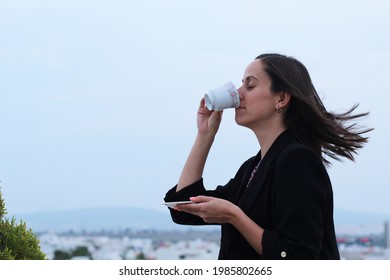 Mexican Pretty Woman Drinking Coffee At The Top Of Terrace. Morning Breakfast.