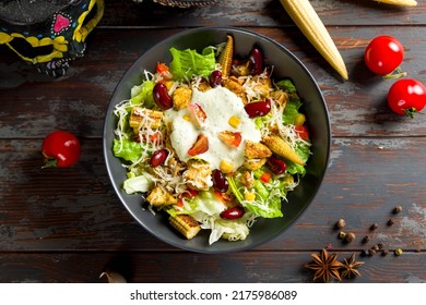 Mexican Salad With Chicken, Corn And Red Beans Top View On Wooden Table