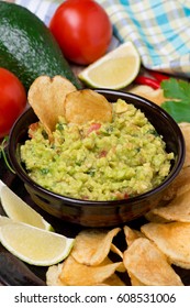 Mexican sauce guacamole in a bowl, vertical - Shutterstock ID 608531006