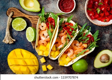 Mexican Shrimp Tacos With Avocado, Tomato, Mango Salsa On Rustic Stone Table. Recipe For Cinco De Mayo Party. Top View, Overhead, Flat Lay. 