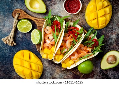 Mexican Shrimp Tacos With Avocado, Tomato, Mango Salsa On Rustic Stone Table. Recipe For Cinco De Mayo Party. Top View, Overhead, Flat Lay. 