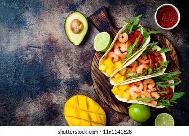 Mexican Shrimp Tacos With Avocado, Tomato, Mango Salsa On Rustic Stone Table. Recipe For Cinco De Mayo Party. Top View, Overhead, Flat Lay. 