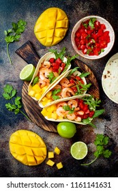 Mexican Shrimp Tacos With Avocado, Tomato, Mango Salsa On Rustic Stone Table. Recipe For Cinco De Mayo Party. Top View, Overhead, Flat Lay. 