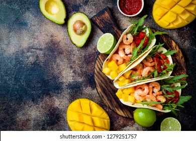 Mexican Shrimp Tacos With Avocado, Tomato, Mango Salsa On Rustic Stone Table. Recipe For Cinco De Mayo Party. Top View, Overhead, Flat Lay. 