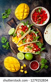 Mexican Shrimp Tacos With Avocado, Tomato, Mango Salsa On Rustic Stone Table. Recipe For Cinco De Mayo Party. Top View, Overhead, Flat Lay. 