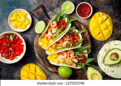 Mexican Shrimp Tacos With Avocado, Tomato, Mango Salsa On Rustic Stone Table. Recipe For Cinco De Mayo Party. Top View, Overhead, Flat Lay. 