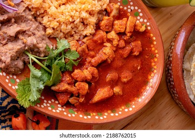 Mexican Spicy Pork Stew - Mexican Food Whit Chile Colorado, Rice And Beans.