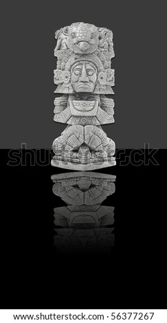 Mexican statue, isolated against dark background (incl. clipping path)