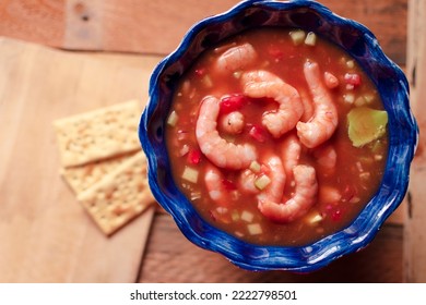 Mexican Style Blue Wave Plate Served With Shrimp Cocktail And Crackers On Wooden Background, High Angle.