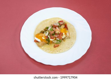 Mexican Taco With Fajita Filling With Pico De Gallo, Stewed Chicken Meat On White Plate And Red Background