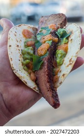 Mexican Taco Made With Brisket, Guacamole And Vinaigrette