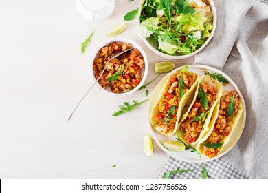 Mexican Tacos With Chicken Meat, Corn And Tomato Sauce. Latin American Cuisine. Taco, Tortilla, Wrap. Top View. Flat Lay