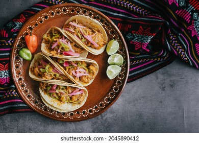 mexican tacos flat lay composition with pork carnitas, cochinita pibil, onion and habanero chili traditional food in Mexico - Shutterstock ID 2045890412