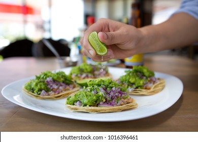 Mexican tacos with guacamole and lemon