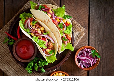 Mexican Tacos With Meat, Vegetables And Red Onion. Top View