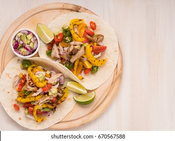 Mexican Tacos On Pita With Vegetables Salad, Meat, Pepper And Corn On Rustic Wooden White Table Background. Recipe Traditional Food. Top Flat View, Overhead.