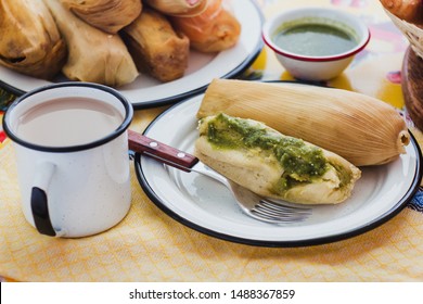mexican tamal of corn leaves with chili and green sauce and atole, Tamale in Mexico City