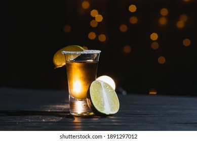 Mexican tequila with lime and salt on rustic wood background. space for text. concept luxury drink. Alcoholic drink concept.