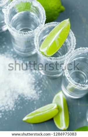 Mexican Tequila in short glasses with lime and salt