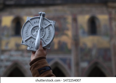 Mexican Tortilla Maker With Blurry Hungarian Church In Background