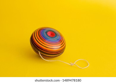 Mexican Toys, Yoyo From Wooden In Mexico On Yellow Background