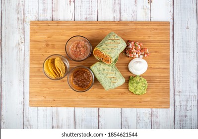 Mexican Veggie Burrito On A Wooden Table