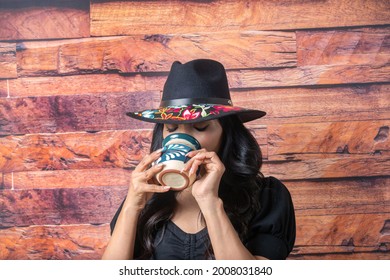 Mexican Woman Drinking Chocolate Coffee From Colorful Cup To Relax