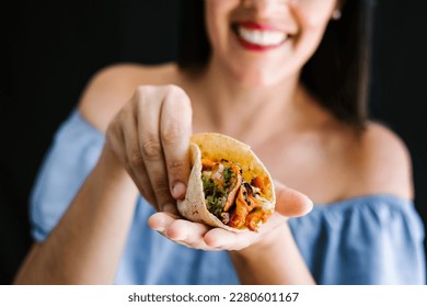 Mexican woman eating tacos al pastor, mexican food in Mexico Latin America	 - Shutterstock ID 2280601167