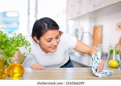 Mexican Woman Housewife Is Cleaning Furniture At Home Kitchen