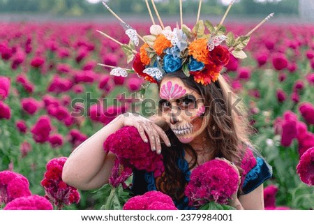 Mexican Woman in Mexico, Catrinas makeup in flower field, bautiful woman wearing traditional costume, crown of flowers and butterflyes, standing on field among blooming marigold flowers dayay of dead