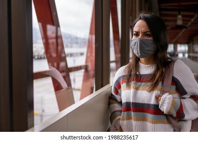 Mexican Woman Walking Down The Aisle With A Travel Bag