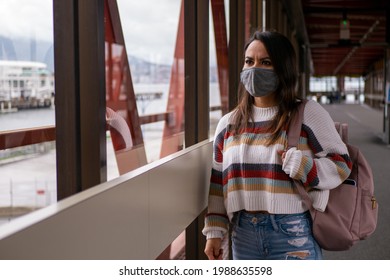 Mexican Woman Walking Down The Aisle With A Travel Bag