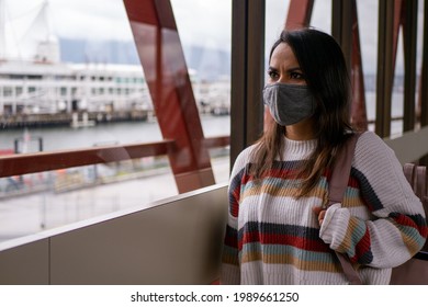 Mexican Woman Walking Down The Aisle With A Travel Bag