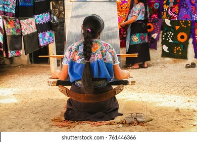 Mexican woman working loom in Chiapas Mexico