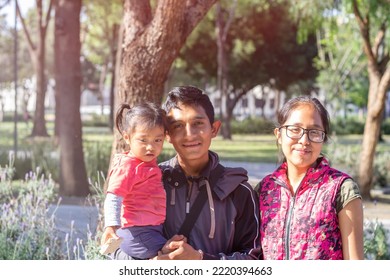 Mexican Young Family. Hispanic Mom, Dad And Baby Girl