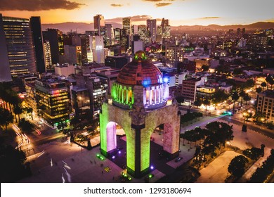 Mexico City, Mexico, Aerial View Of Architectural Landmark Monumento A La Revolucion At Plaza De La Republica At Dusk.