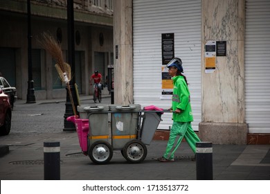 Mexico City, Mexico – April 09, 2020: Cleaning Crew In Mexico Wearing The Protective Gear Needed Due To Coronavirus Pandemia.