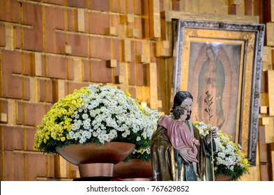 Mexico city- August 08, 2012 The Basilica of Our Lady of Guadalupe ,the  Image of Saint Joseph and the child Jesus, with the painting of the Virgin behind.