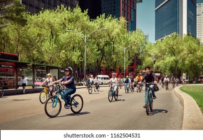 Mexico City, Mexico - August 10, 2018: Urban Cycling Race With Happy Participants Under A Blue Sky 