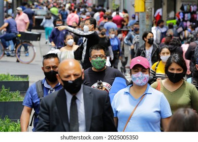 Mexico City, Mexico - August 14, 2021: People Wear Face Masks To Protect From Coronavirus, COVID-19 Pandemic, As They Walk By A Street In Downtown CDMX.