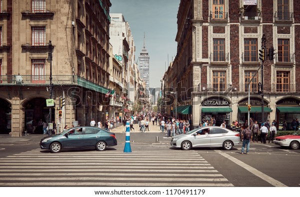 Mexico City, Mexico - August
22, 2018: Urban scene with people from downtown Mexico City, Mexico
in Summertime. Roads, traffic, sidewalks, everyday
life.