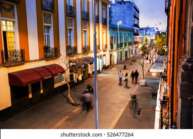 Mexico City Is The Capital Of Mexico. Nightlife In Mexico City. Streets Of The Center With Blurred People, Bars, Restaurants And Cafes.