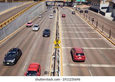 Mexico City, CDMX, Mexico 02-06-2021 Cars circulating in light traffic over Melchor Ocampo Avenue (known as Circuito Interior) on a beautiful sunny day.