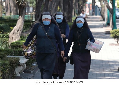 Mexico City, CDMX - 31-MARCH-2020: 
Nuns wear a protective mask to go out to sell cookies on the streets of Mexico city as a precaution against the COVID-19 pandemic
