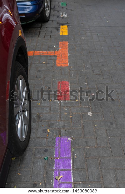 MEXICO CITY, CDMX / MEXICO - JUNE, 23, 2019:\
Parking outlines in the Zona Rosa section of Mexico City painted as\
the LGBTQ flag.