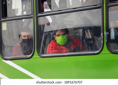 Mexico City, Mexico - January 11, 2021: Commuters Wear Face Masks To Protect From Coronavirus, COVID-19 Pandemic As They Ride A Crowded Bus In Downtown CDMX During Rush Hour.