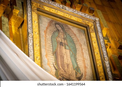 Mexico City, Mexico.
January 16th 2020. Our Lady of Guadalupe image with mexican flag in Mexico City National Shrine