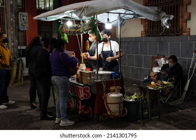 MEXICO CITY, MEXICO - JANUARY 28, 2022: Street Food Stand At Night, Cooking And Selling Fried Corn Or 