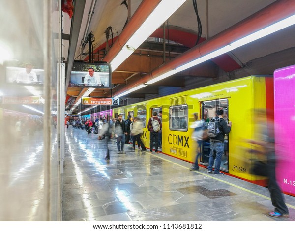 Mexico city - June\
10, 2018: Panoramic view of a metro station in Mexico City, people\
waiting on the platform