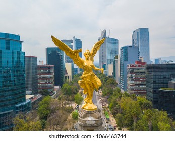 Mexico City - March 17, 2017: frontal aerial view of the statue of the angel of independence on Reforma Avenue with Chapultepec forest in the background